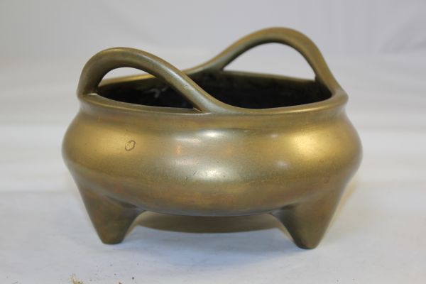 A large Chinese bronze ding shaped censer, Xuande six character mark, probably 18th century, 19.5cm., diam.13.3cm.